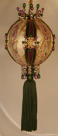 Lush purple and green velvet Victorian Style Christmas Tree ornament with a gold filigree button and Swarovski Crystals