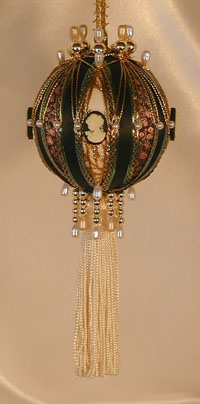 Victorian Ornament with lush tassel, shades of hunter and gold, accented with a beautiful cameo