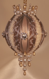 A gold scroll jacquard, rich and textured, silver and gold, rhinestones and lace on on one gorgeous heirloom ornament