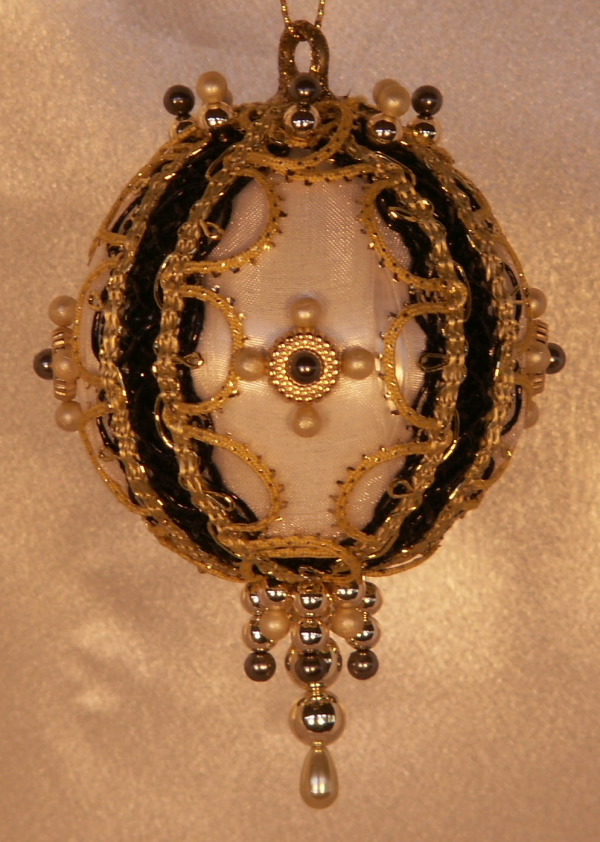 Ivory and Black are the themes of this beautiful Christmas Ornament