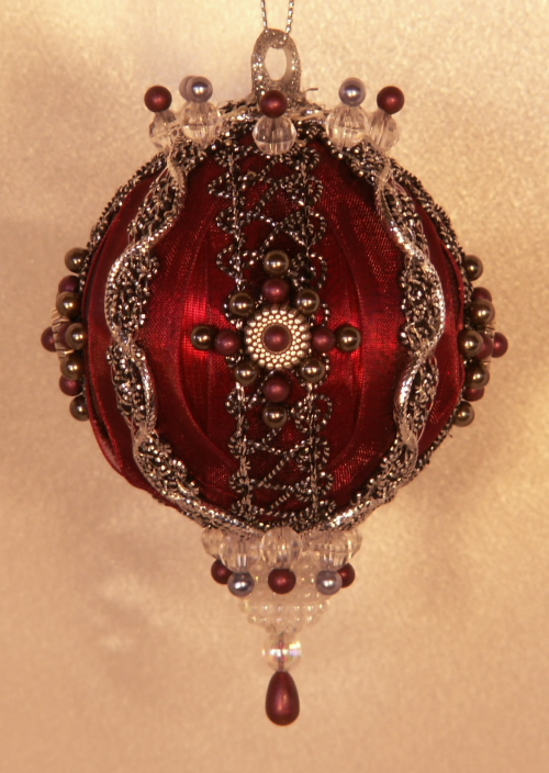 An Old World Look of Deep burgundy and antique silver on this Christmas Ornament