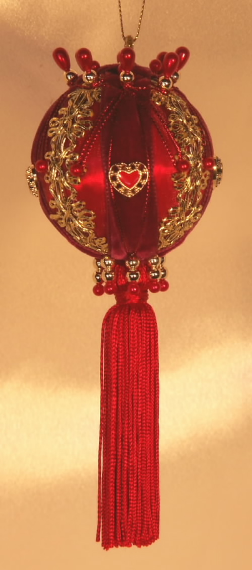 Victorian Red and Burgundy Christmas Tree Ornaments with a beautiful ceramic heart in the middle of each quadrant