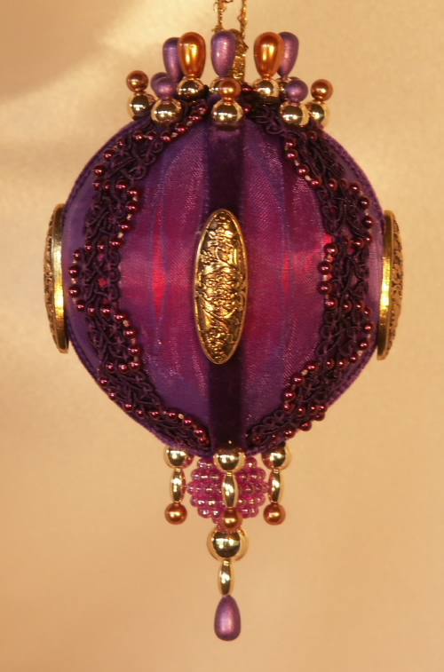 A rich purple and gold Victorian style Christmas tree ornament