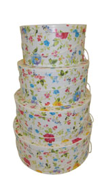 Wild flowers in multi colors of blue rose and daffodil on this Victorian Style set of hatboxes